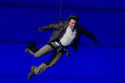 Tom Cruise is lowered on the Stade de France during the 2024 Summer Olympics closing ceremony